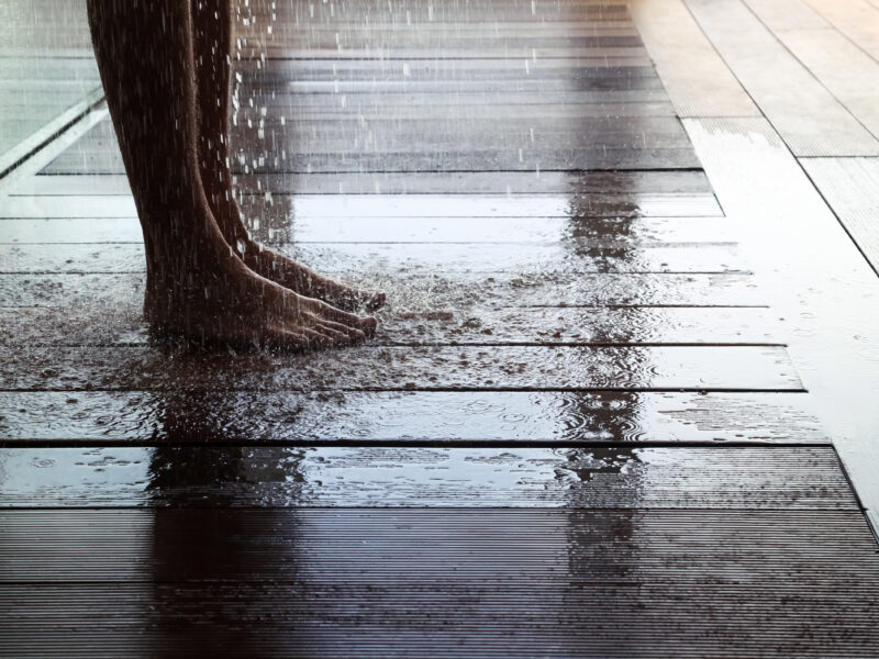 Man,Standing,On,Wet,Wooden,Floor,Taking,Shower,,Low,Section